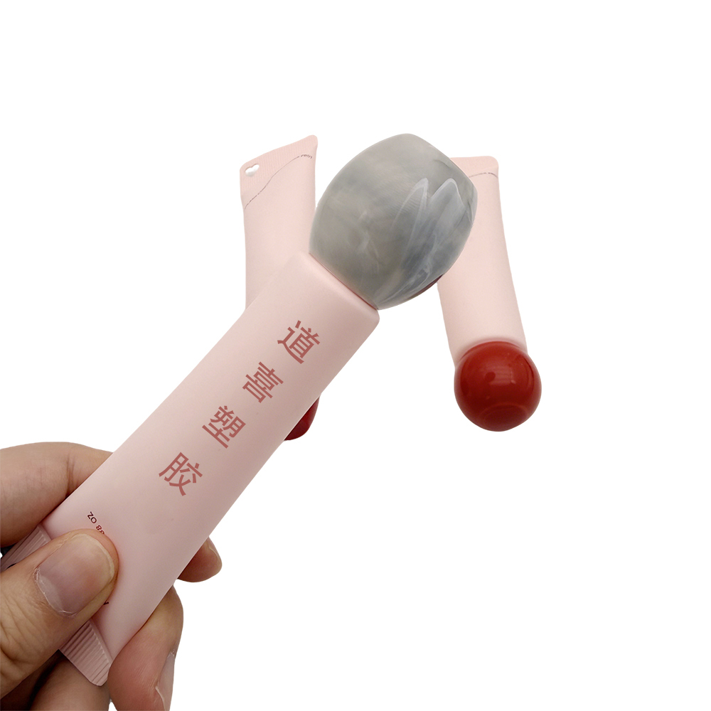 Cosmetic tube with heart hole Cosmetic tube with heart hole